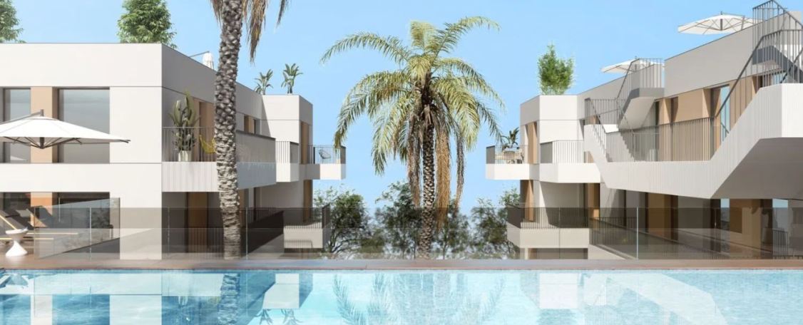 Parcela para 93 viviendas en San Vicente del Raspeig Vista de un complejo moderno de apartamentos con palmeras y piscina.