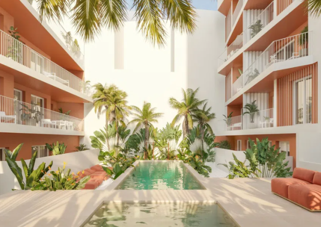 Parcela para construir 33 viviendas Patio elegante con piscina, plantas tropicales y balcones en un entorno moderno.